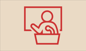 Præst skriver på tavle